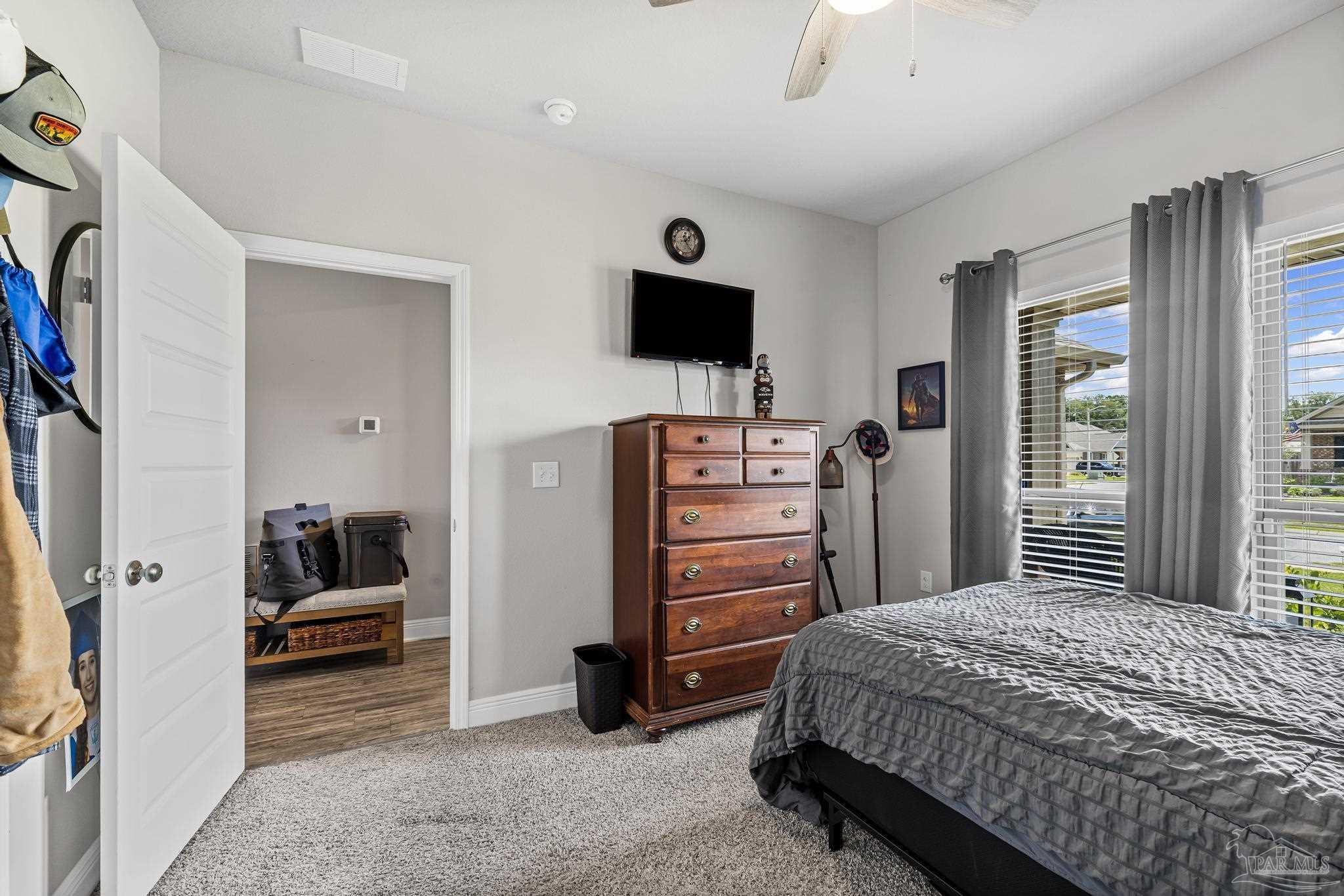 5375 Red Shoulder Road Pace, FL 32571 - Photo 5 of 40 a bedroom with a bed and a television