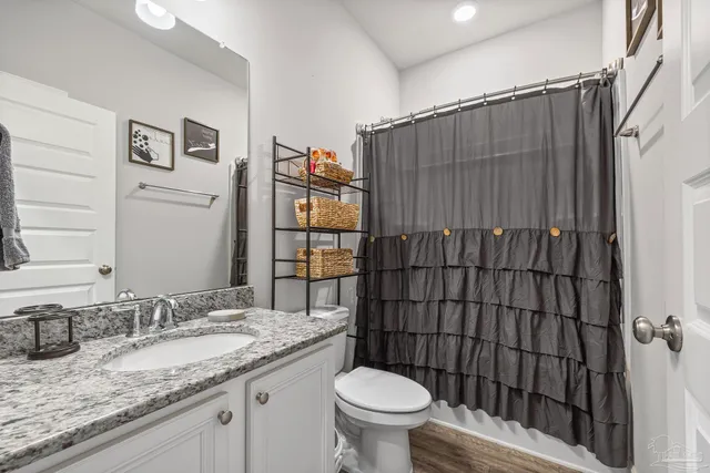 a bedroom with a bed and furniture