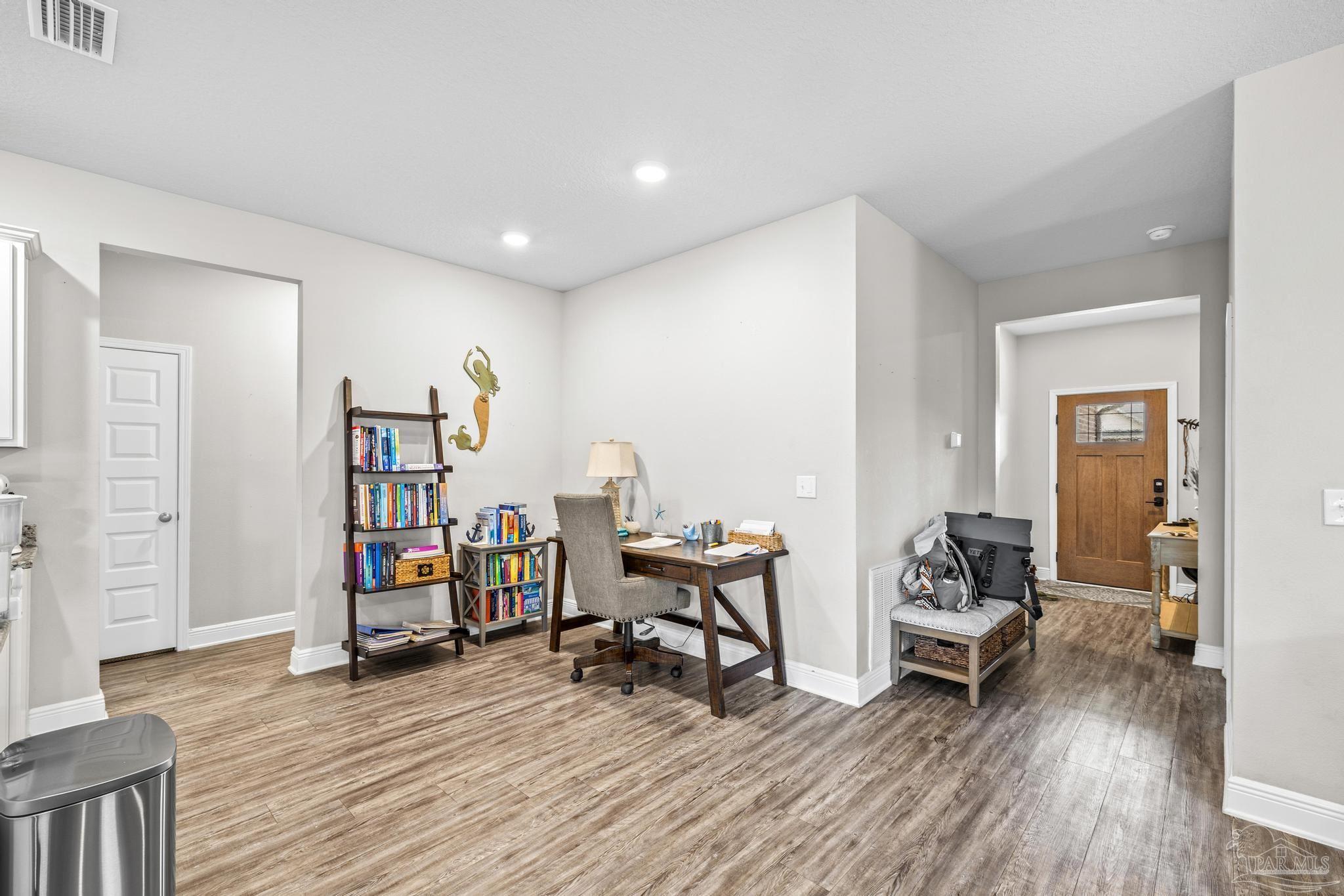 5375 Red Shoulder Road Pace, FL 32571 - Photo 9 of 40 a view of a livingroom with furniture and wooden floor