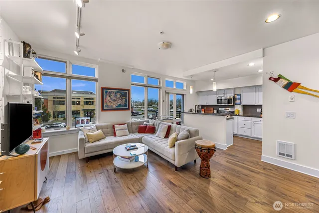 a living room with fireplace furniture and a wooden floor