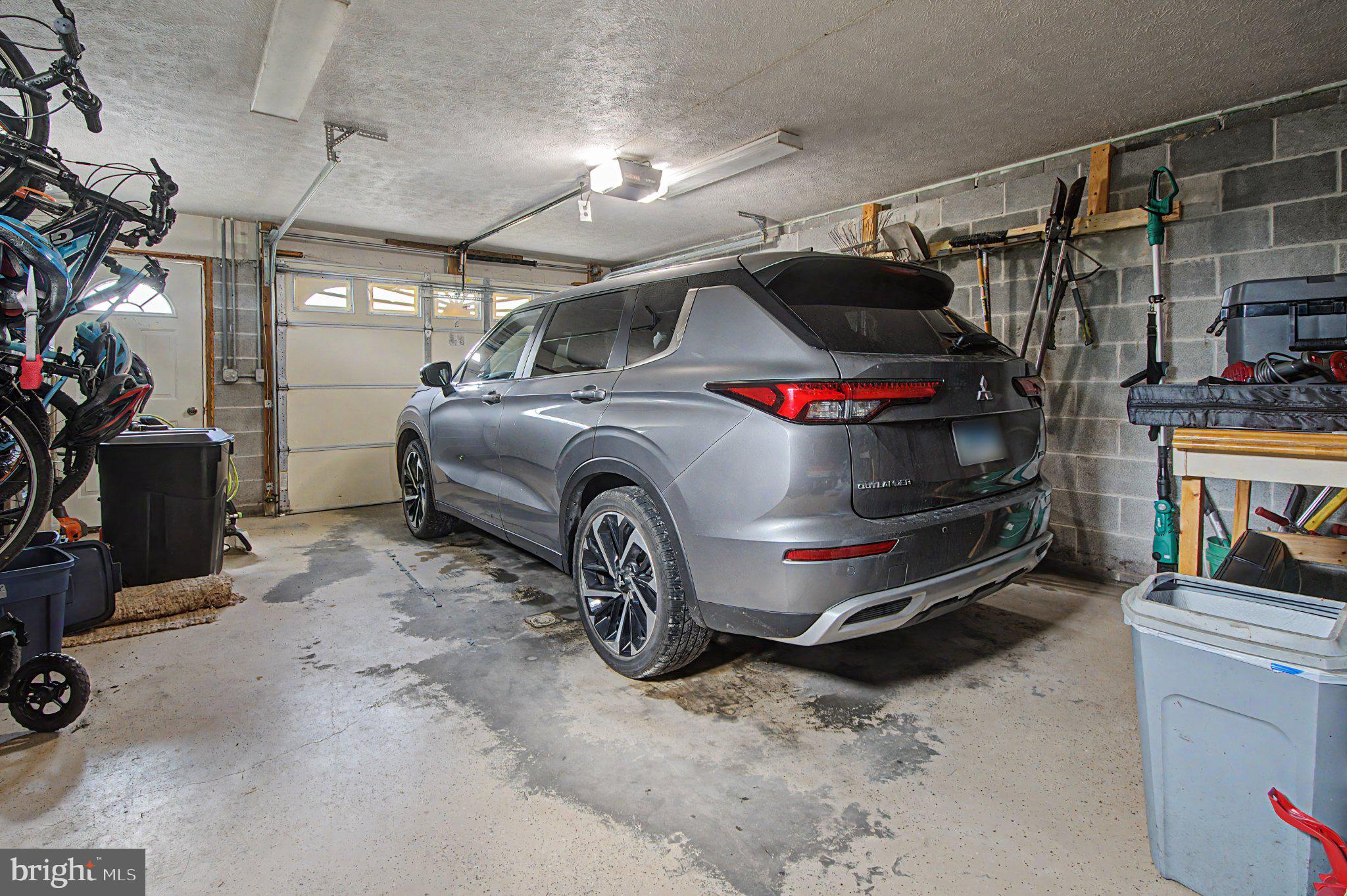 595 Pysell Crosscut Road Oakland, MD 21550 - Photo 60 of 61 Spacious garage with modern SUV.