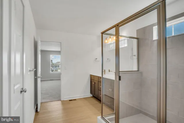 a view of a bathroom with mirror