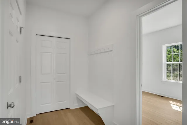 a view of room with window and hardwood floor
