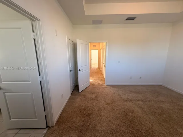 a bathroom with a tub a sink and a large mirror