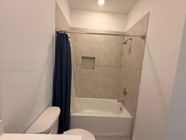 an empty room with a empty space and window