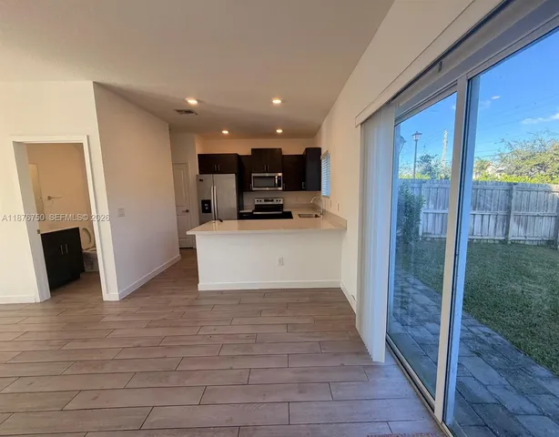 a view of a kitchen with furniture and a fireplace