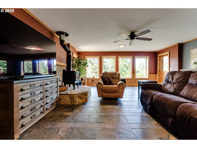 a spacious bedroom with a bed and a dresser