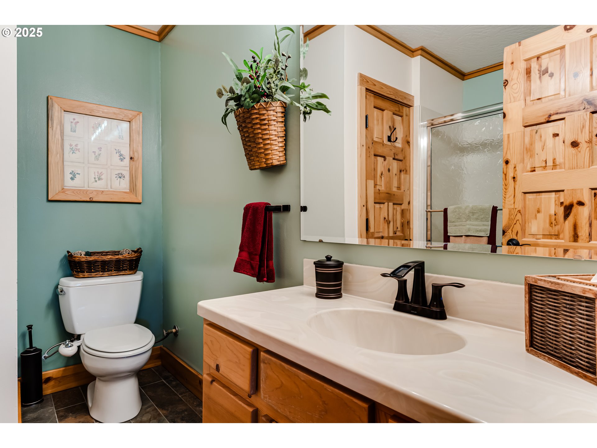 86561 R.R. Baker Road Springfield, OR 97478 - Photo 32 of 47 a bathroom with a toilet sink and mirror