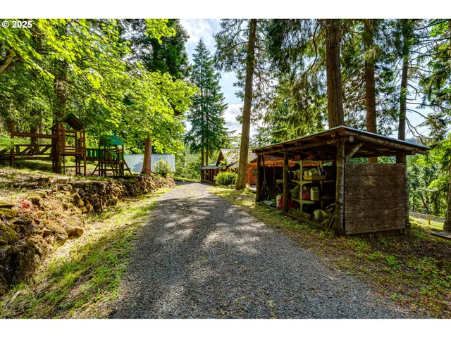 a view of a backyard with sitting area