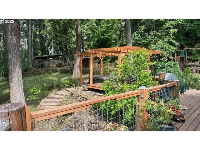 a backyard of a house with table and chairs