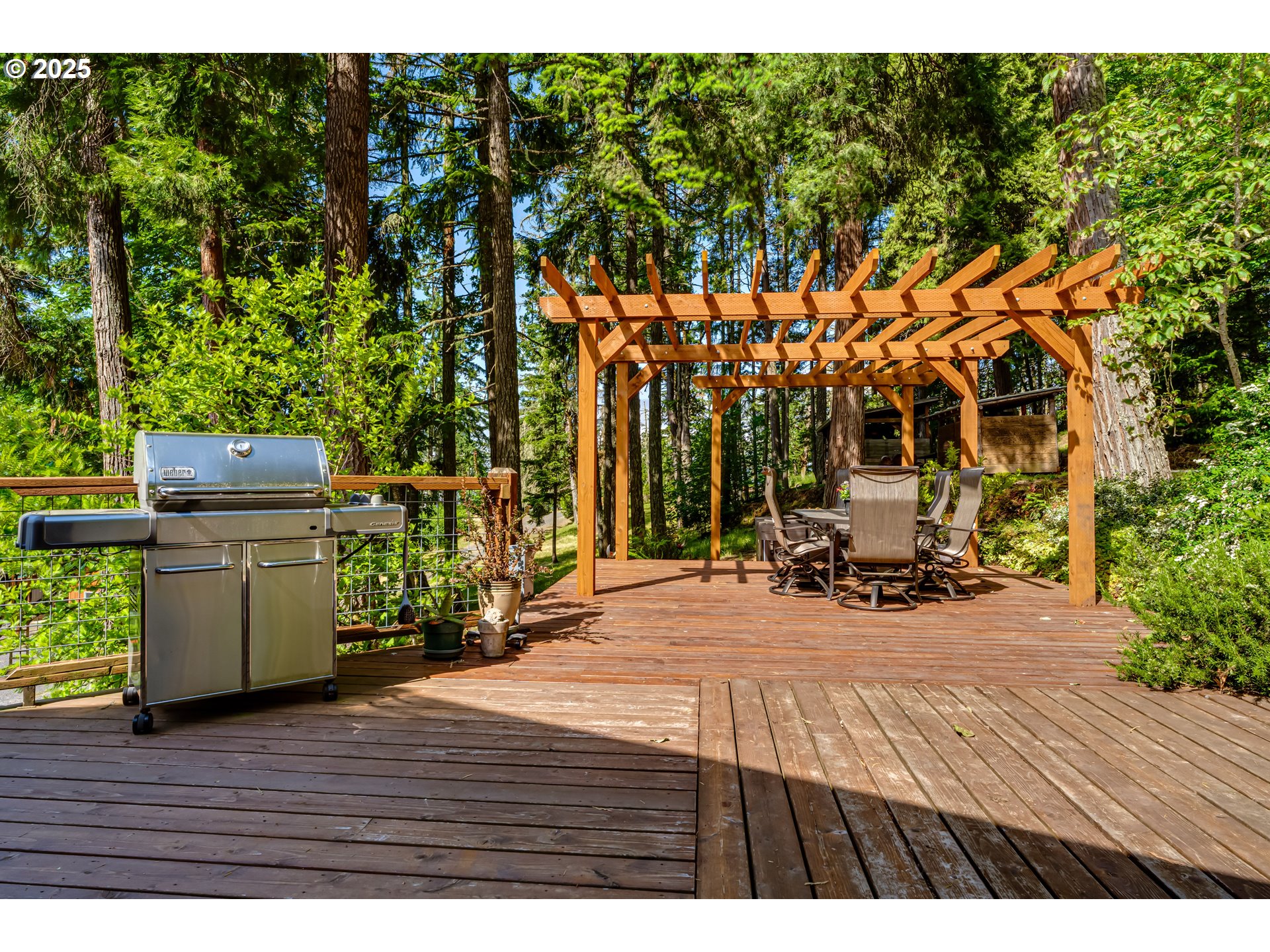 86561 R.R. Baker Road Springfield, OR 97478 - Photo 41 of 47 a view of a patio with table and chairs and potted plants