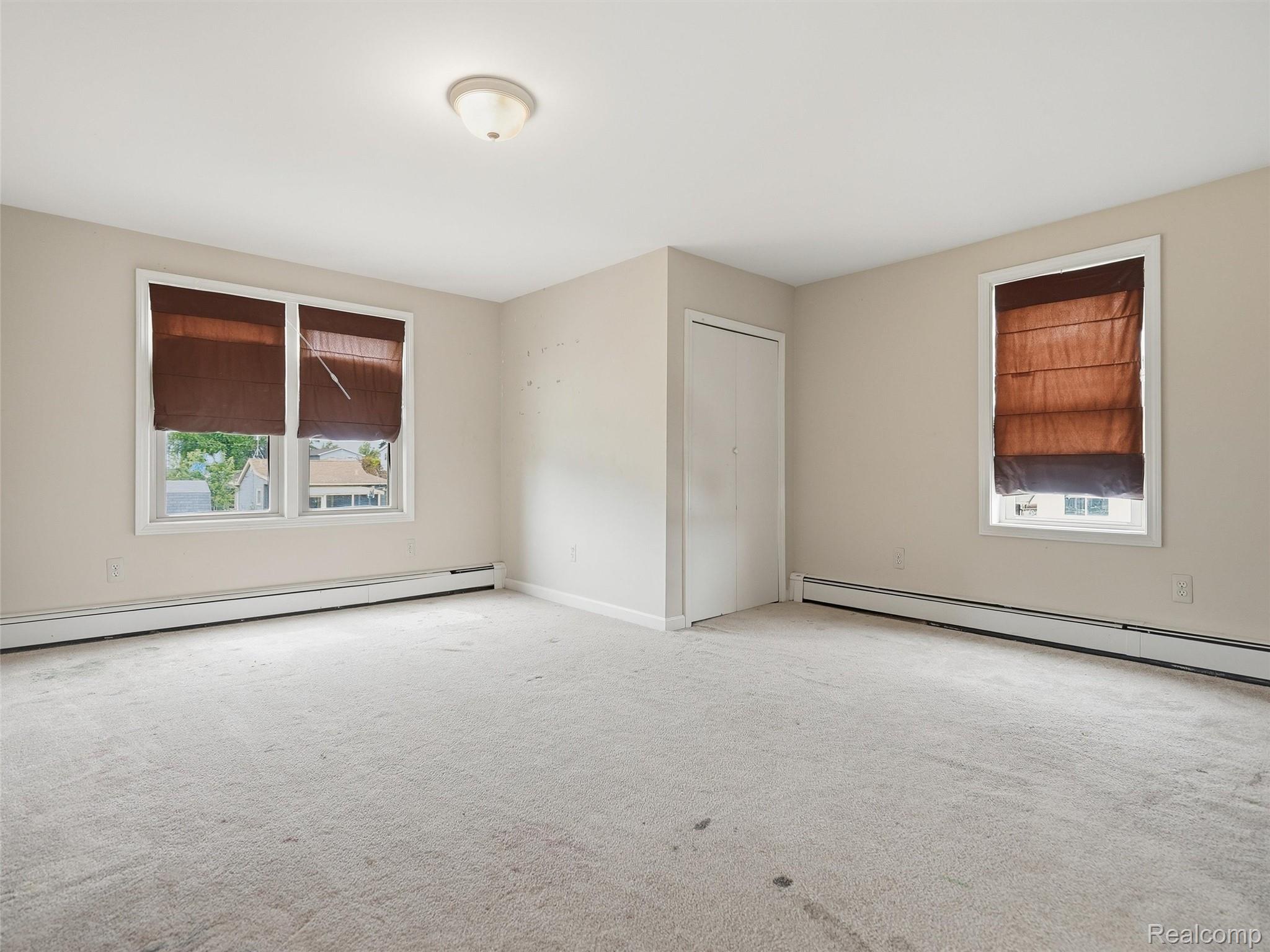 117 Kenyon Road Algonac, MI 48001 - Photo 28 of 47 Carpeted room featuring neutral wall tones and a flush-mount ceiling light fixture