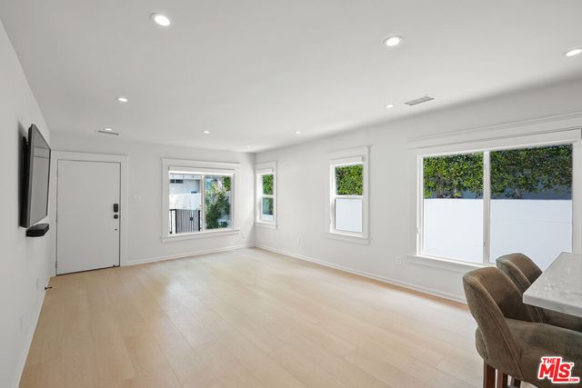 a kitchen with stainless steel appliances refrigerator and cabinets