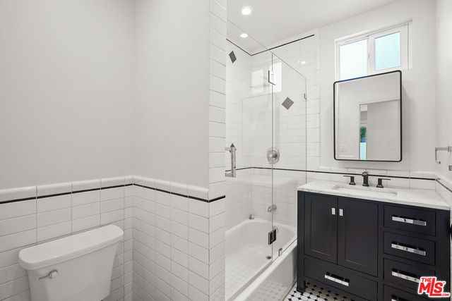 an empty room with windows and natural light