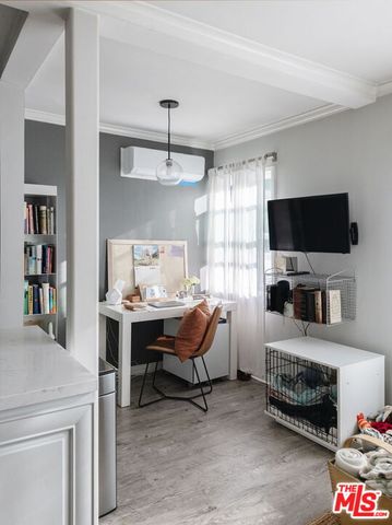 a kitchen with stainless steel appliances a sink a stove and cabinets