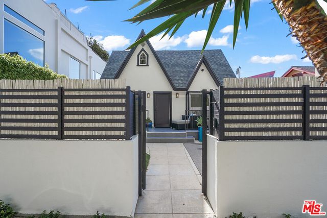 a view of a roof deck with furniture