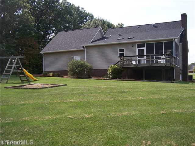 262 Eldora Road Ararat, NC 27007 - Photo 2 of 16 Exterior Back. Back view showing deck and screened porch.