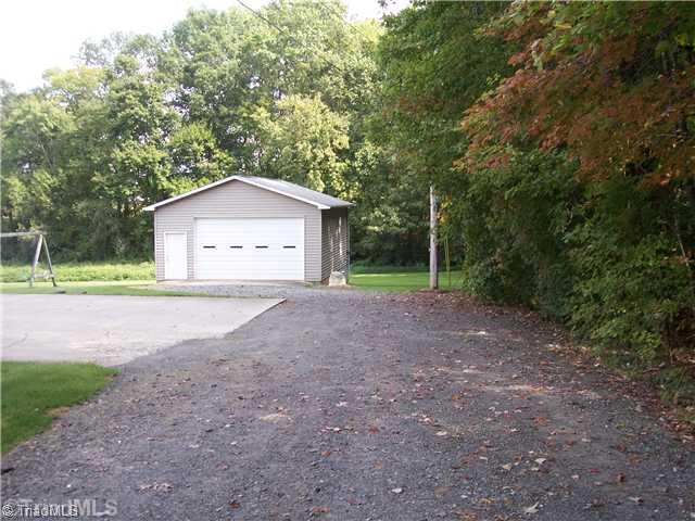 262 Eldora Road Ararat, NC 27007 - Photo 3 of 16 Outbuilding. 20x30 detached garage and shop wired and outside water at building.