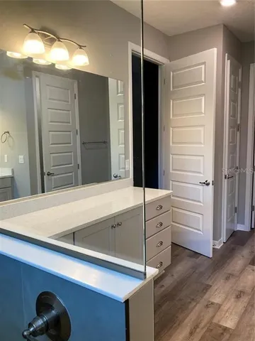 a bathroom with a tub and a shower