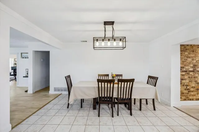 a view of a livingroom with furniture and a window