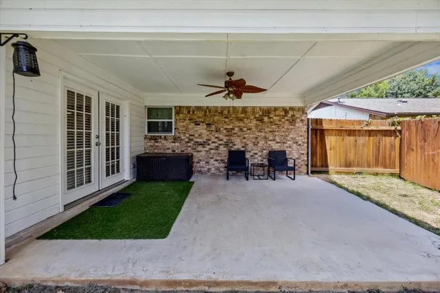 a view of a porch and livingroom with furniture