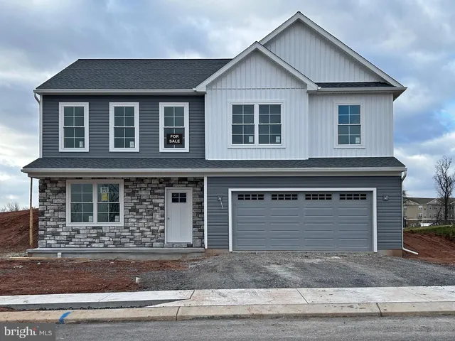 a front view of a house with garage