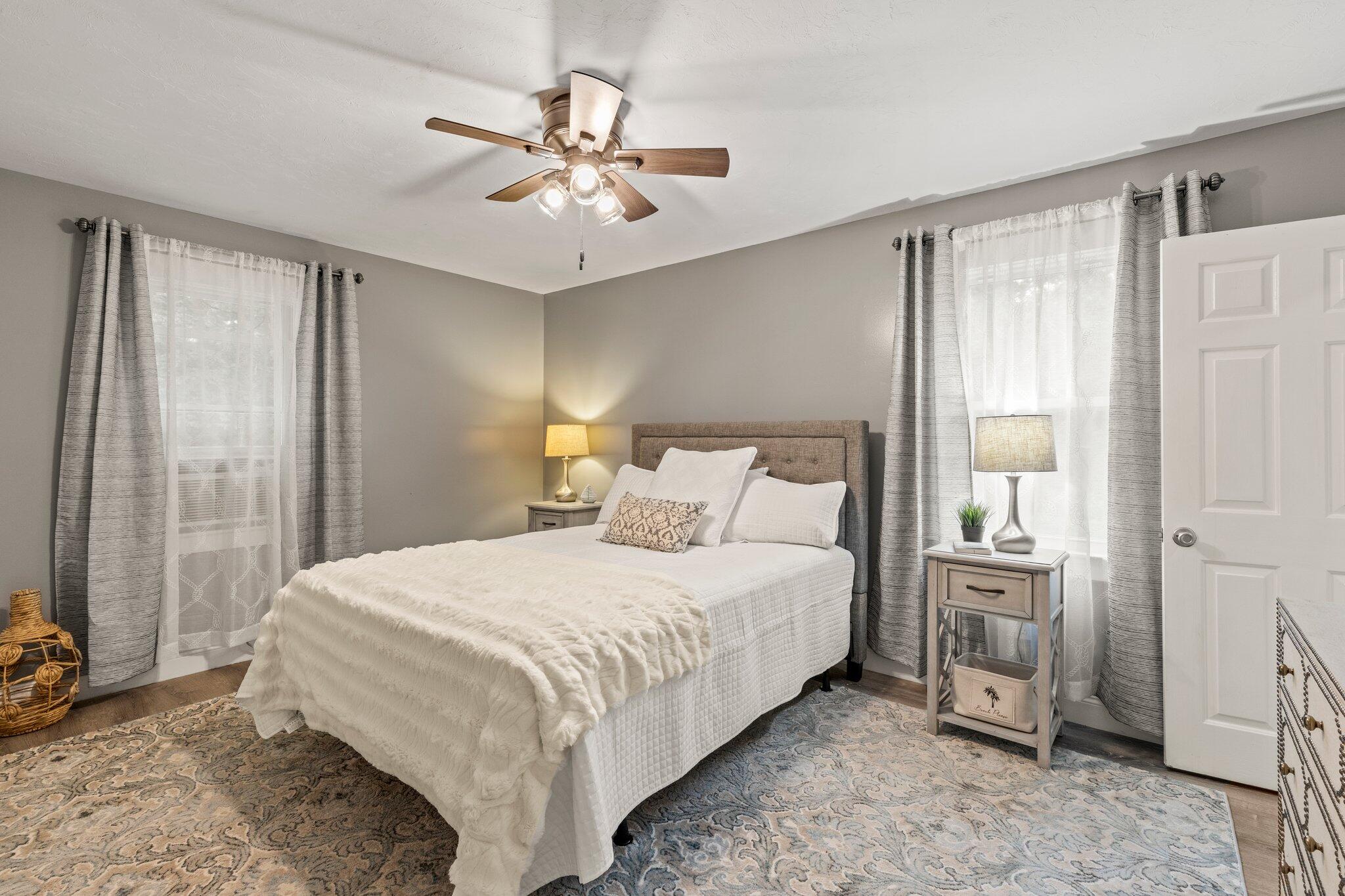 36 Chartwell Drive Buzzards Bay, MA 02532 - Photo 12 of 30 a bedroom with a large bed and a chandelier