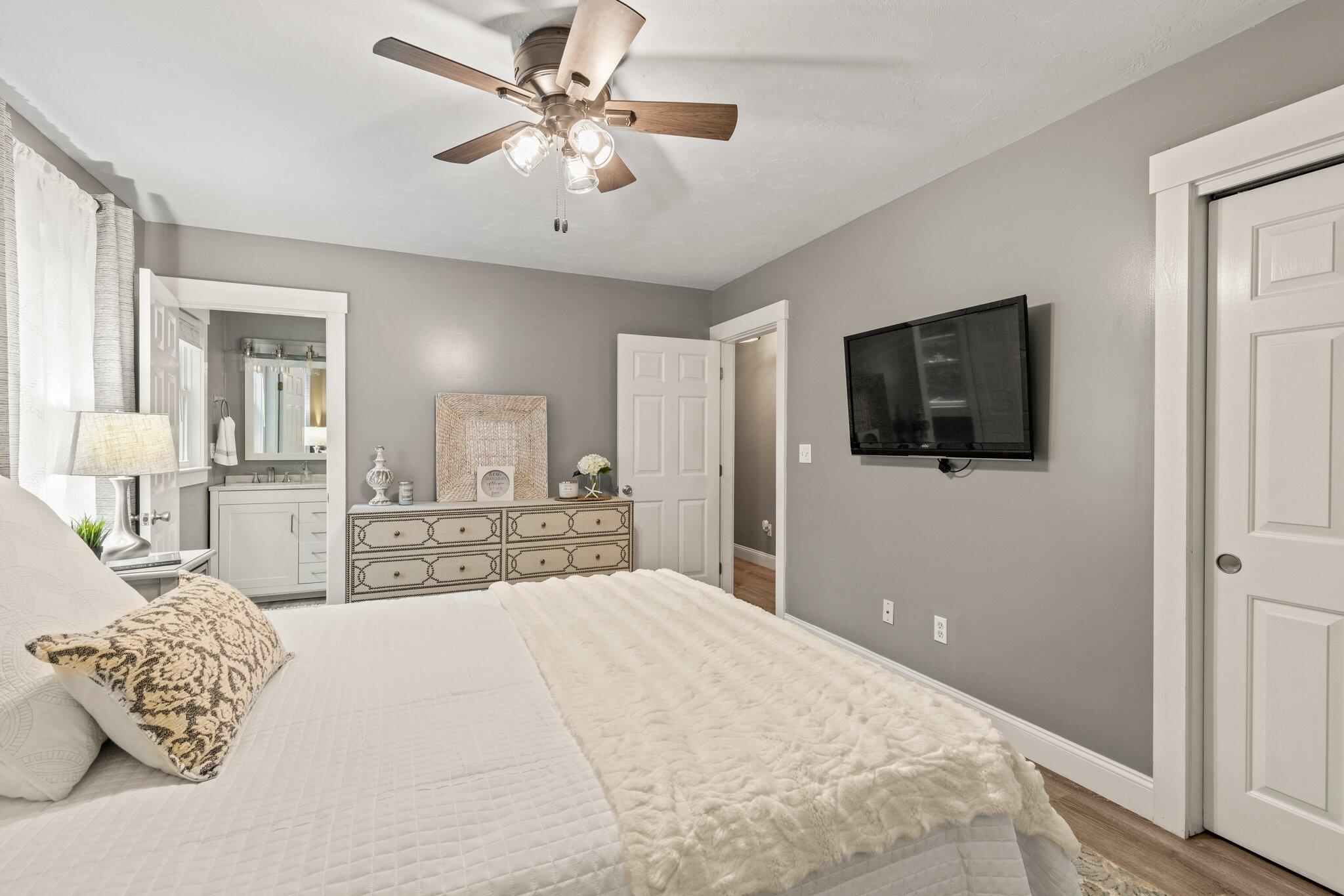 36 Chartwell Drive Buzzards Bay, MA 02532 - Photo 15 of 30 a spacious bedroom with a large bed and a flat screen tv