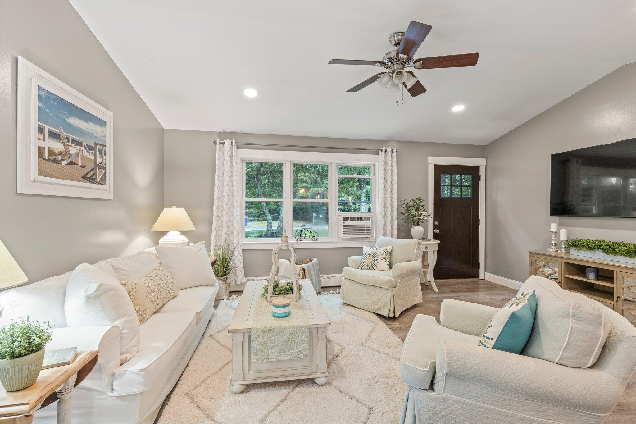 36 Chartwell Drive Buzzards Bay, MA 02532 - Photo 3 of 30 a living room with furniture ceiling fan and a flat screen tv