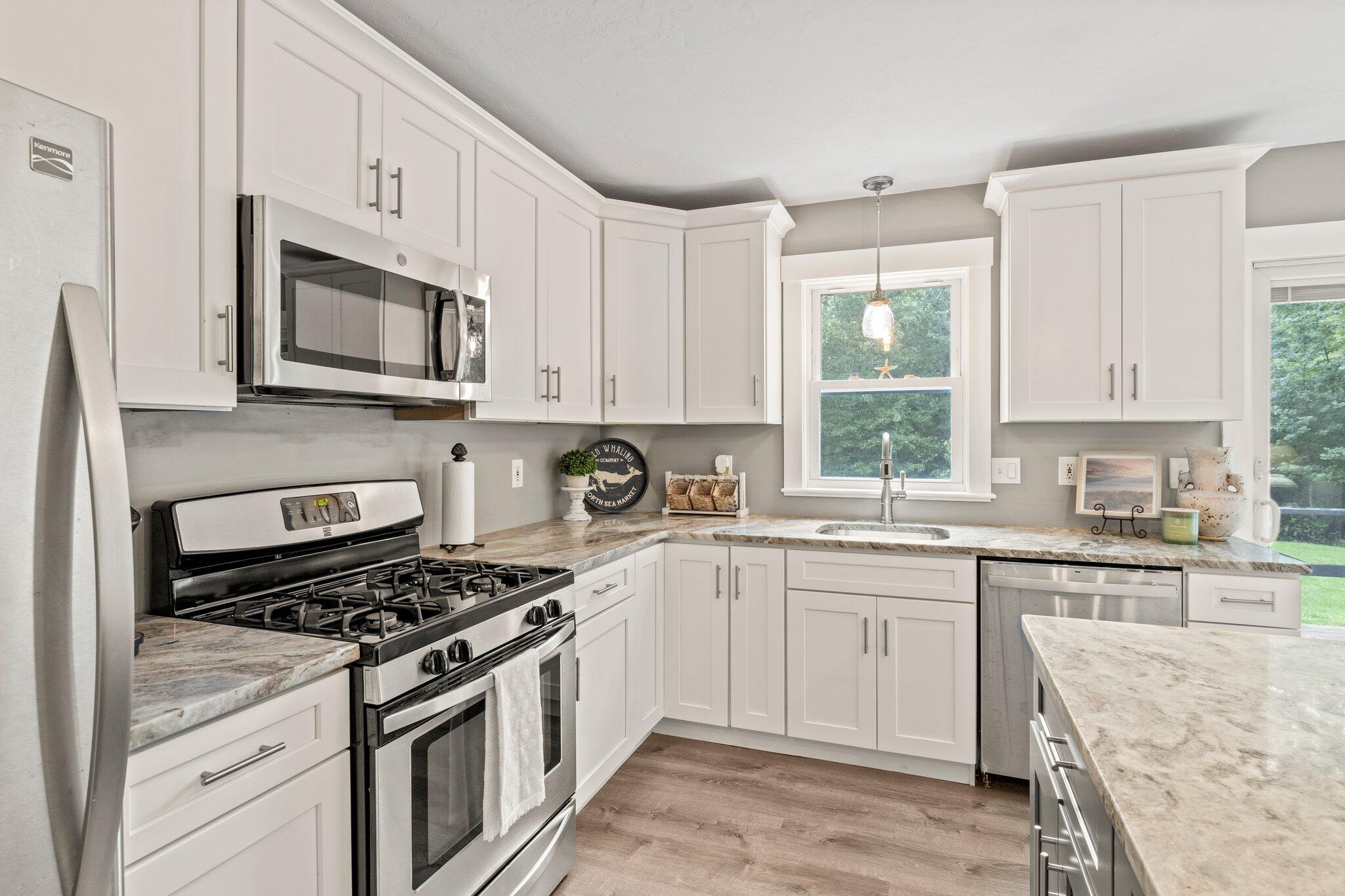 36 Chartwell Drive Buzzards Bay, MA 02532 - Photo 7 of 30 a kitchen with cabinets appliances a sink and a window