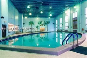 a view of swimming pool from a balcony