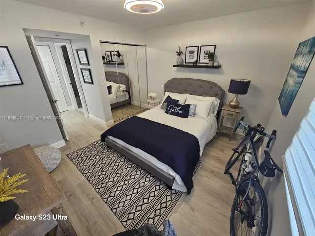 a bedroom with a bed and a walk in closet