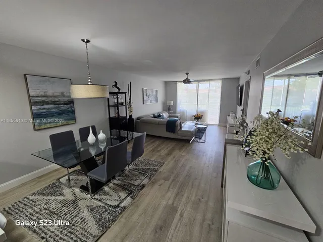 a kitchen with a refrigerator a stove top oven a sink and dishwasher