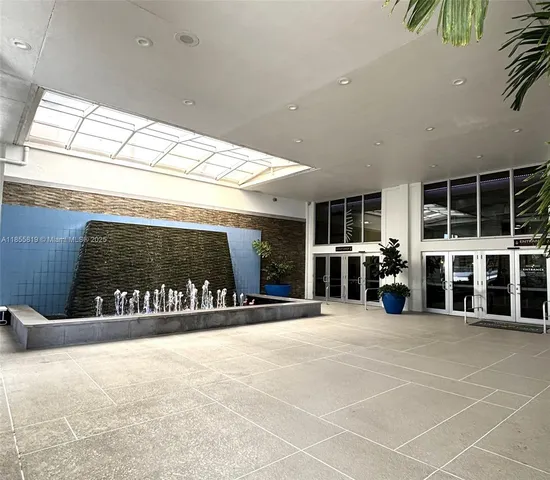 a view of a building with glass door