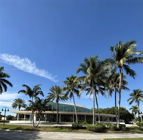 a view of road with palm trees