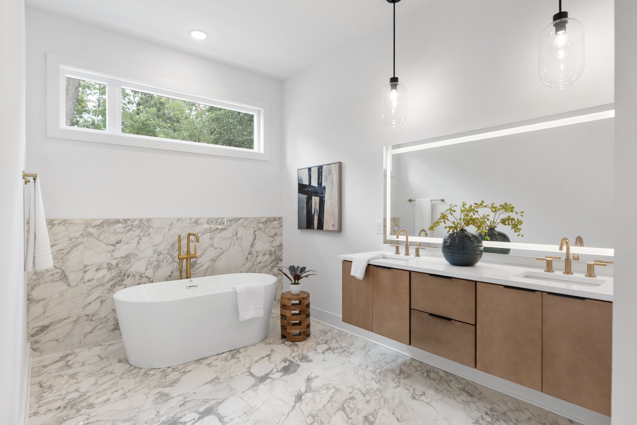 a bathroom with a tub sink and mirror