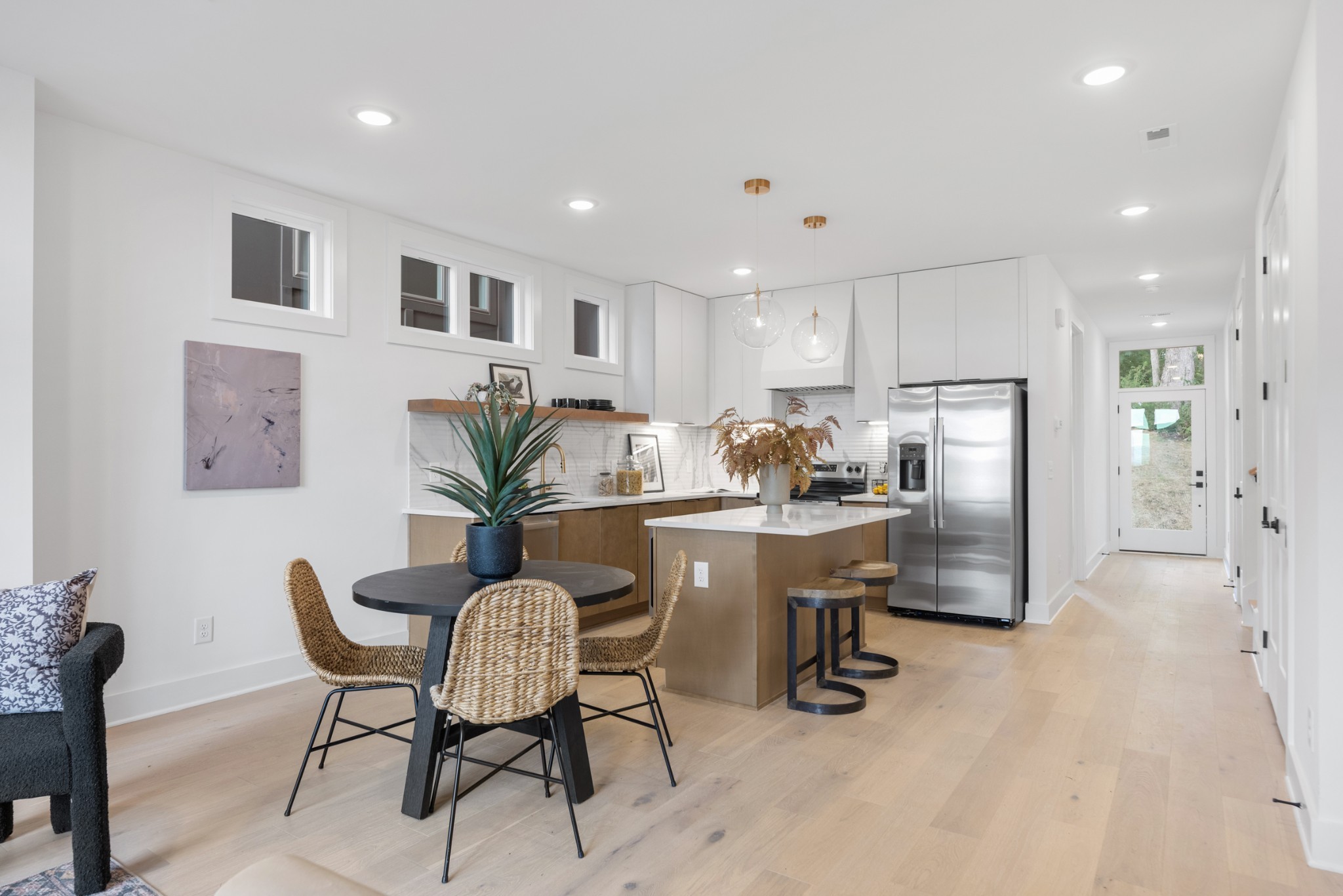 3025 Edwin Street Nashville, TN 37207 - Photo 11 of 48 a kitchen with stainless steel appliances kitchen island granite countertop a refrigerator and a dining table