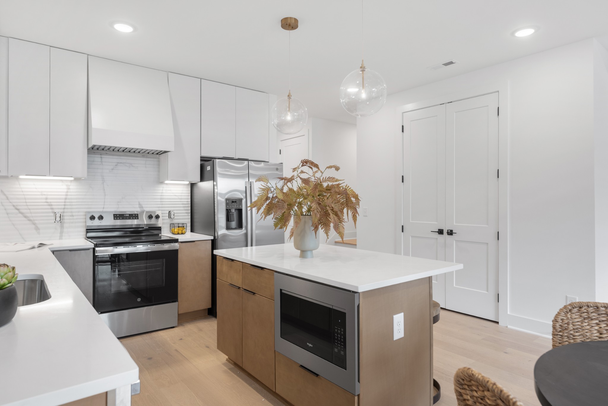 3025 Edwin Street Nashville, TN 37207 - Photo 14 of 48 a kitchen with kitchen island a stove a sink and a refrigerator