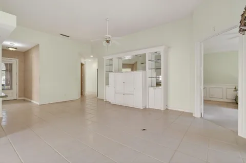 a kitchen with granite countertop a sink a stove and cabinets