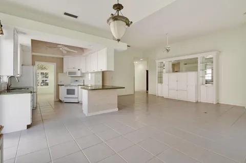 a kitchen with a sink cabinets and stainless steel appliances