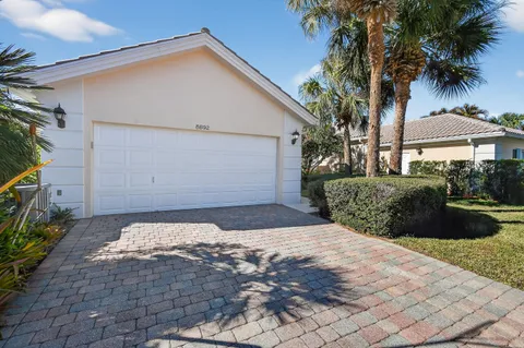 a view of a backyard of the house