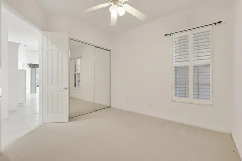 a room with gym equipment and windows
