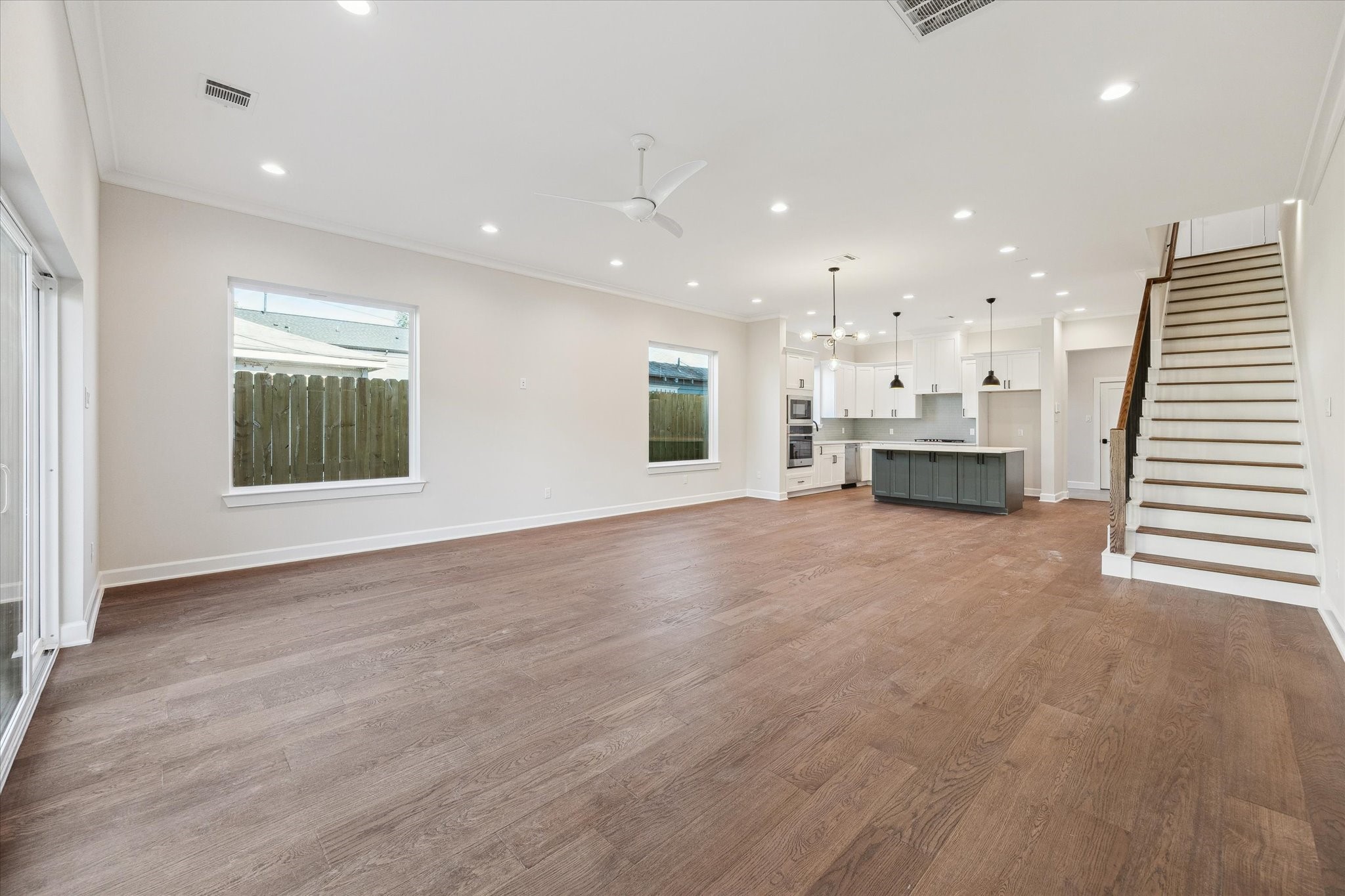 1303 Cordell Street, Unit B Houston, TX 77009 - Photo 11 of 41 an empty room with a kitchen and windows