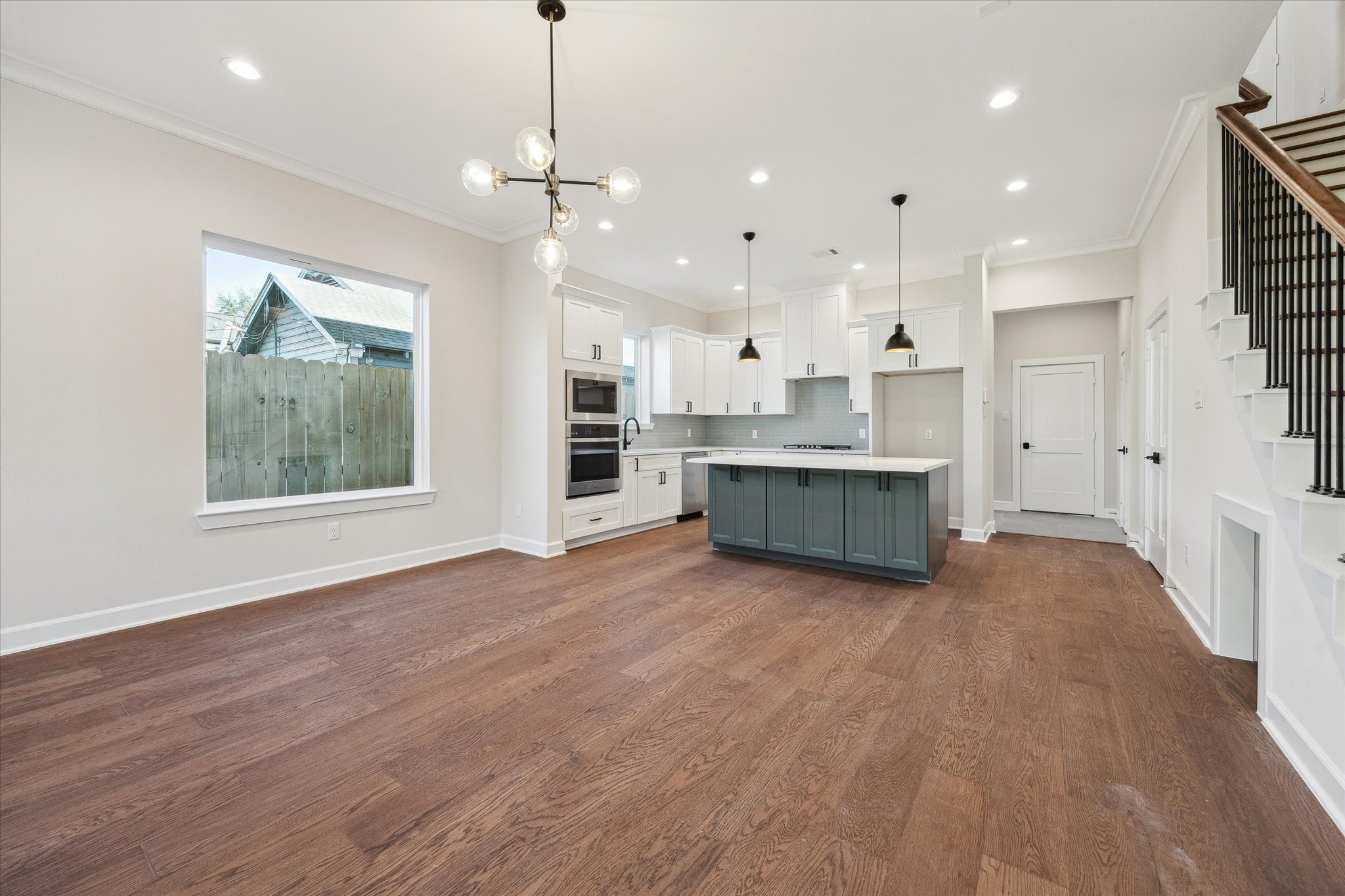 1303 Cordell Street, Unit B Houston, TX 77009 - Photo 13 of 41 a view of kitchen with cabinets and wooden floor