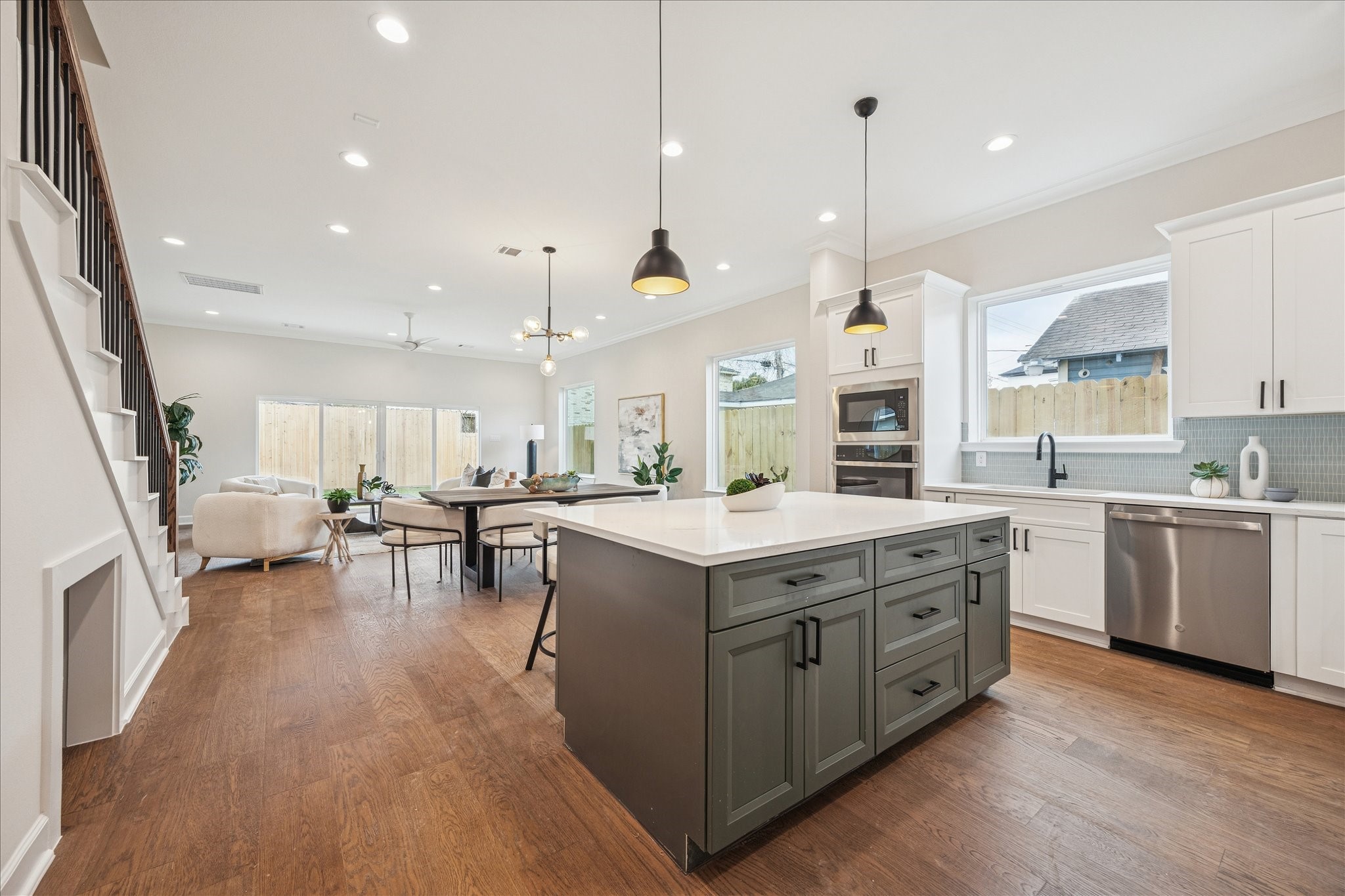 1303 Cordell Street, Unit B Houston, TX 77009 - Photo 19 of 41 a kitchen with a stove oven and chairs