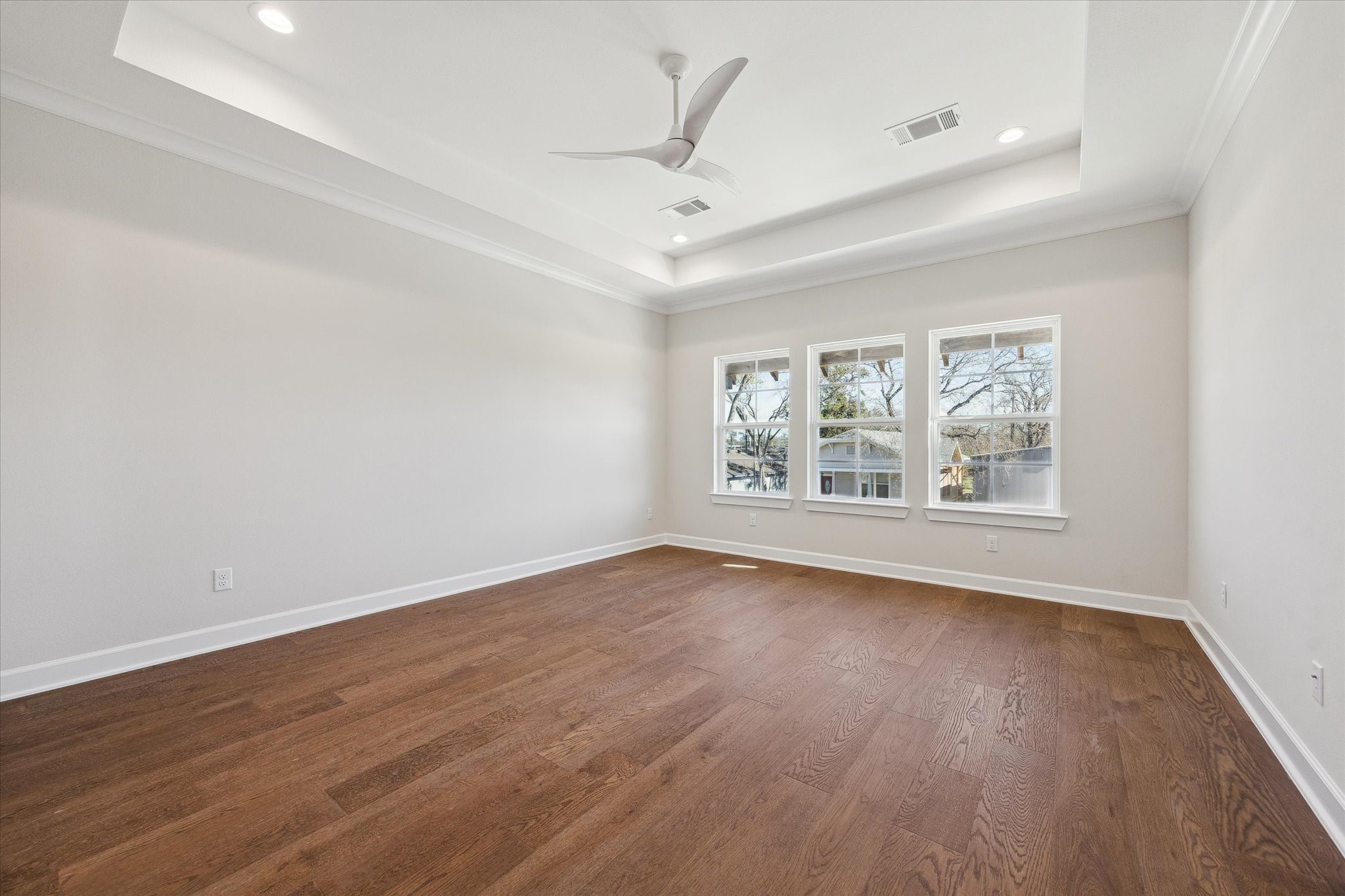 1303 Cordell Street, Unit B Houston, TX 77009 - Photo 25 of 41 an empty room with wooden floor and windows