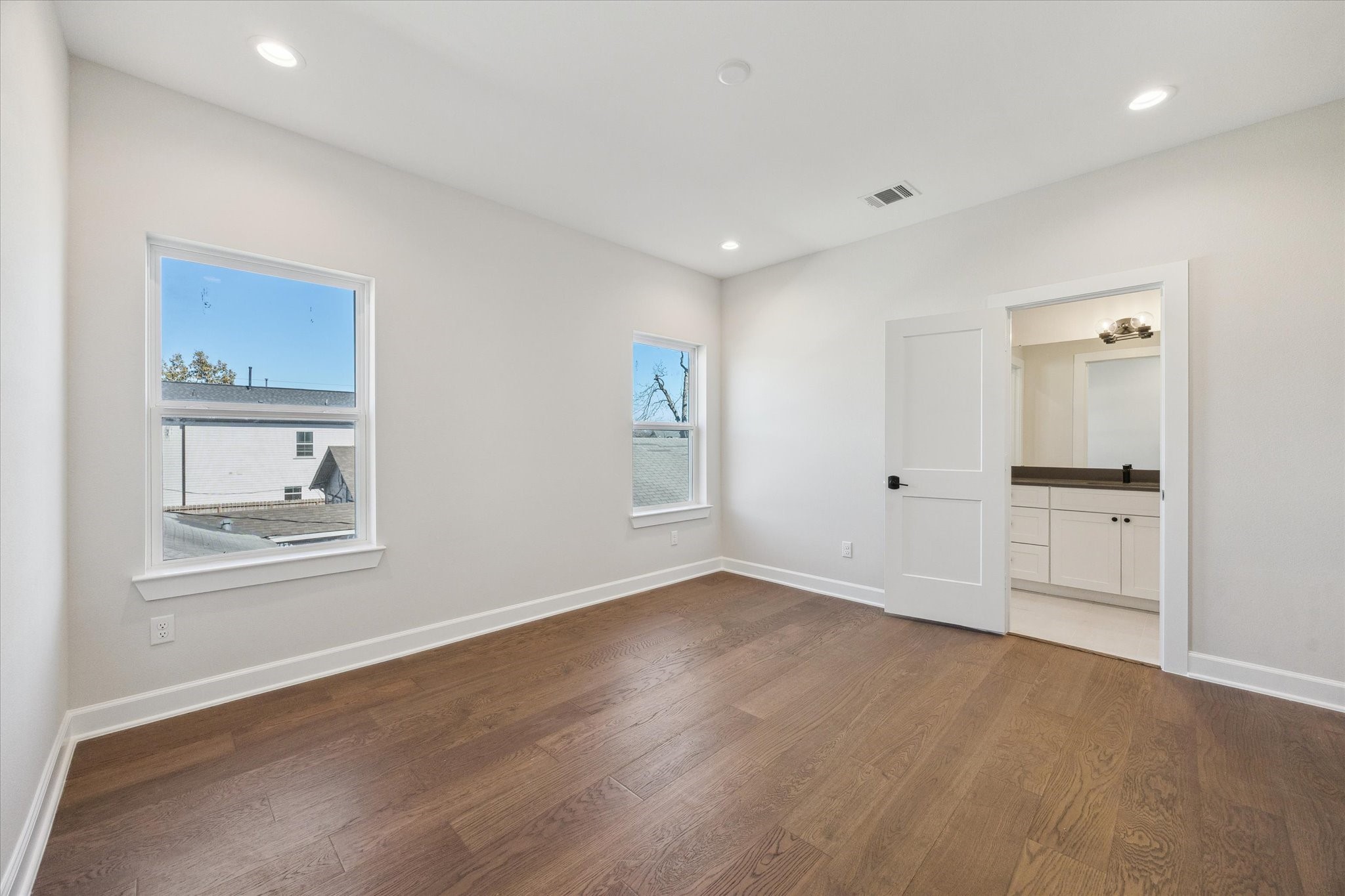1303 Cordell Street, Unit B Houston, TX 77009 - Photo 31 of 41 a view of an empty room with a window and wooden floor