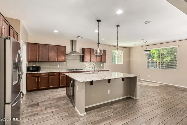 a kitchen with a sink stove and refrigerator