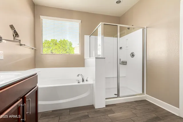 a bathroom with a bathtub and a shower