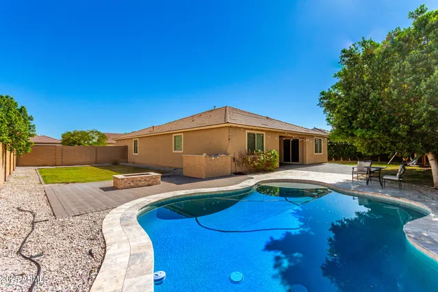 a front view of a house with swimming pool